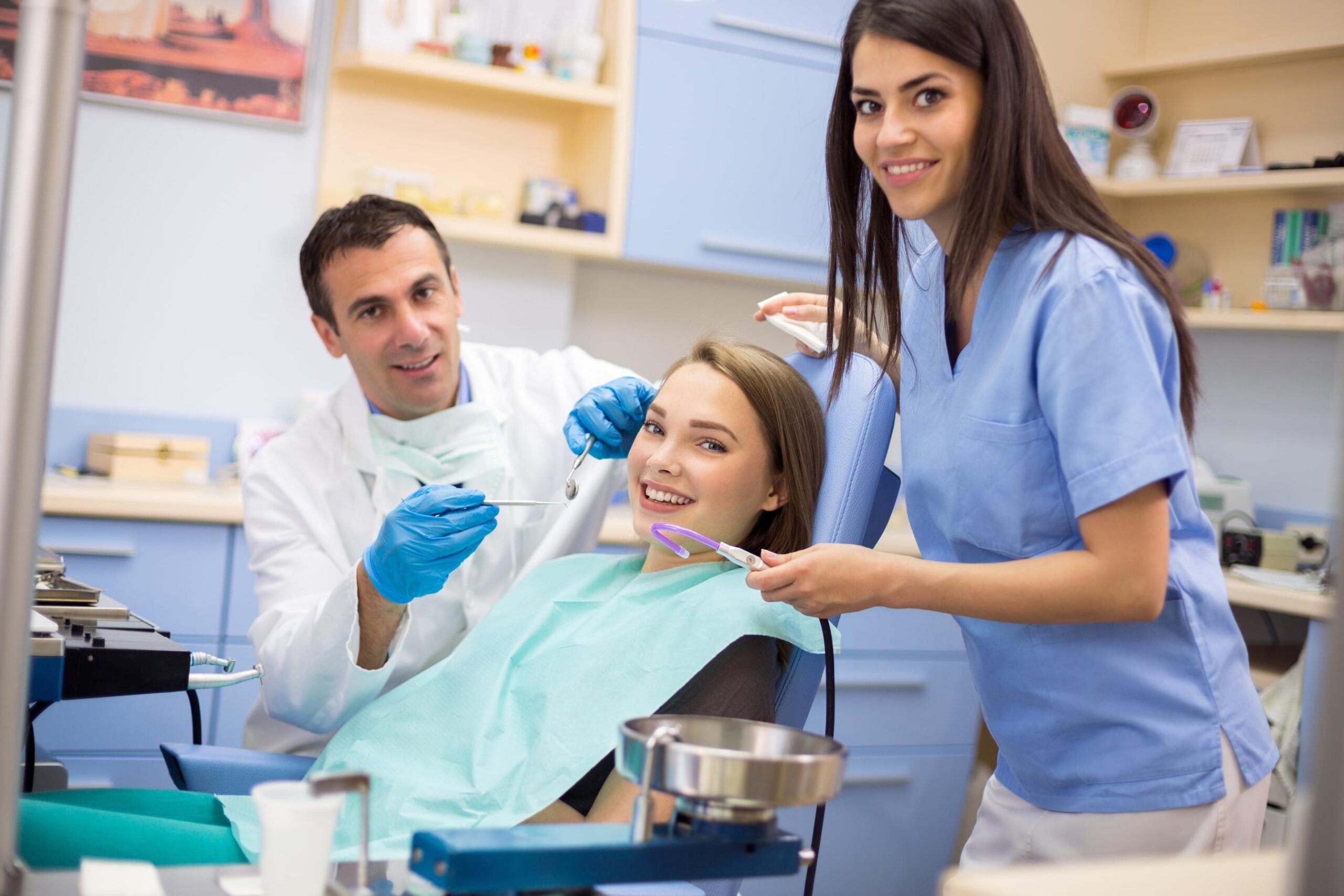 dental treatment with a patient and two dentists
