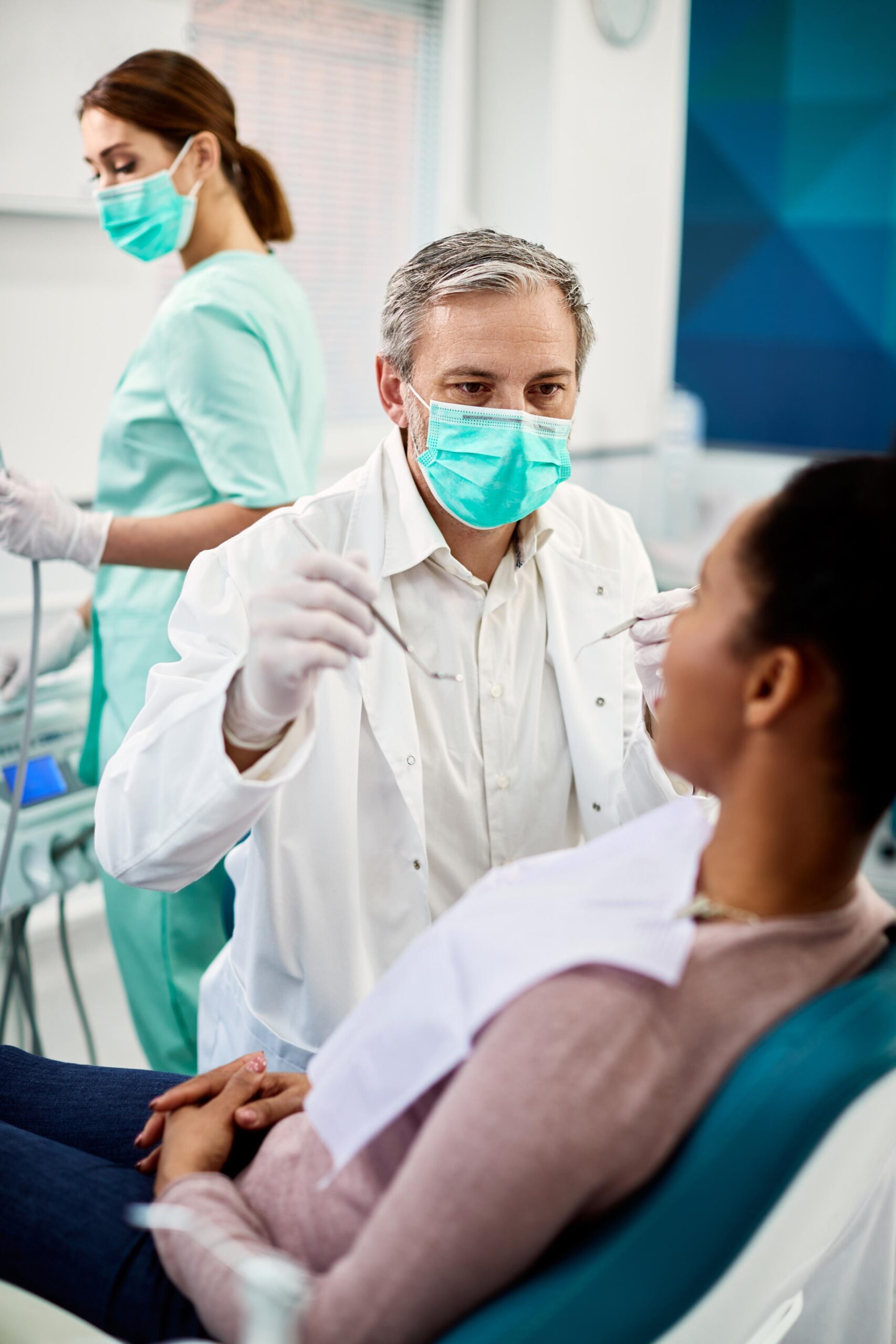 Male dentist examine the patients