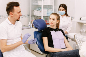 dentist and his assistant give some advice for their female patients.